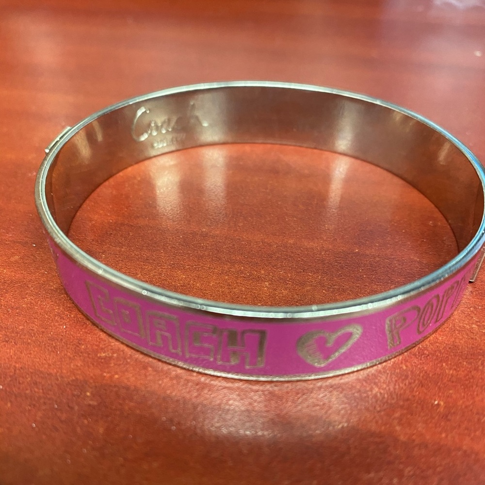 Pink Coach bracelet.
